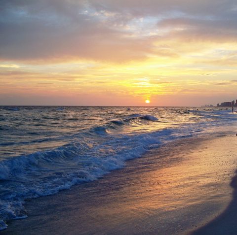 The beach at sunest in Panama City Beach Florida on the Florida Gulf Coast. A glden sunset